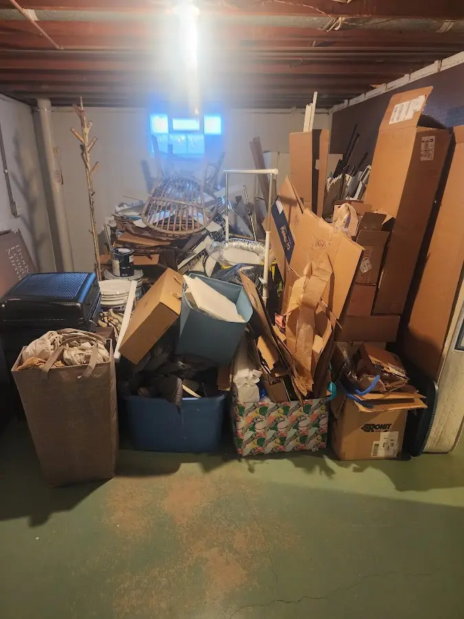 Roll-off dumpster container at job site for 2 Yard Dumpster Rental in Grayling